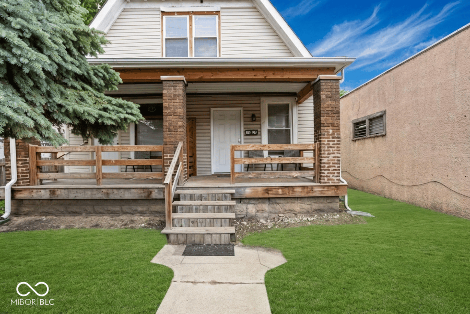 Charming historic duplex exterior on Indianapolis near-east side at 2626 E Michigan St &ndash; classic brick facade, separate entrances, ideal for owner-occupied living near Fountain Square