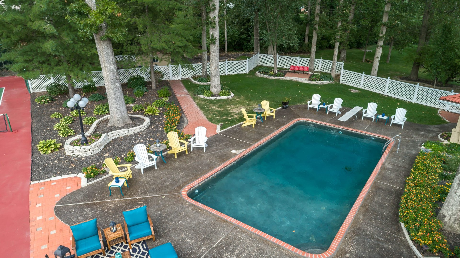 A Special Retreat on a Prized One Acre Lot With Pool and Tennis Court
