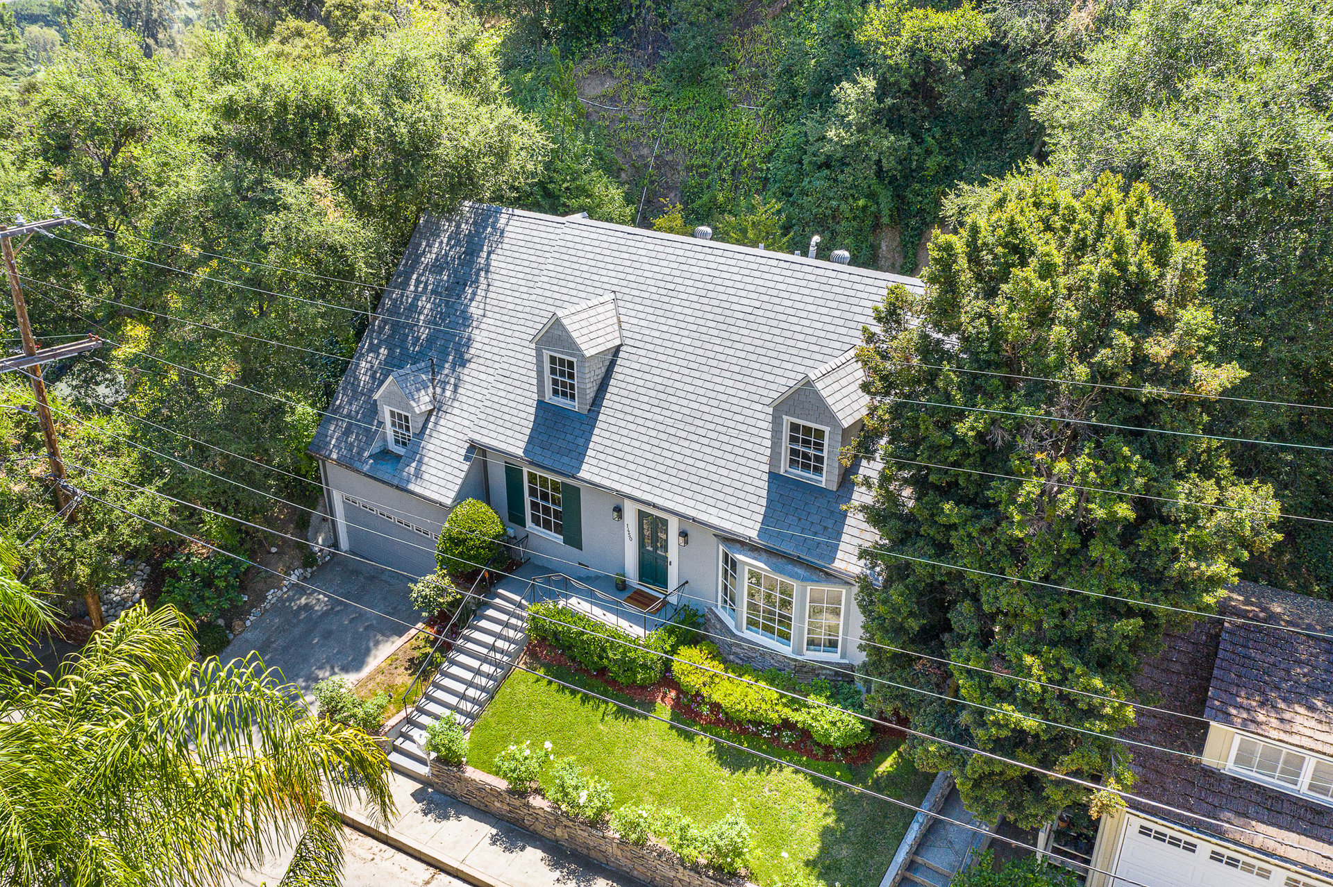 BEAUTIFULLY RESTORED, STORYBOOK CAPE COD HOME IN PRIME VERDUGO WOODLANDS.