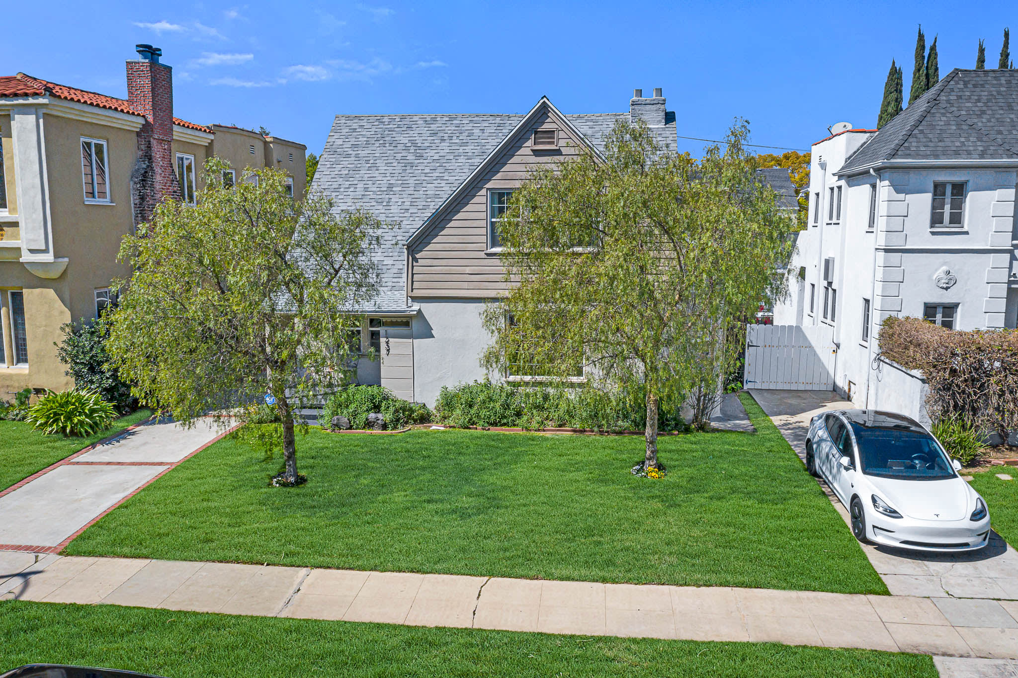 Light & Bright East Coast Traditional Home with Exterior Office & Bonus $2400/mos Rental Unit Above Garage -  in coveted Miracle Mile South!