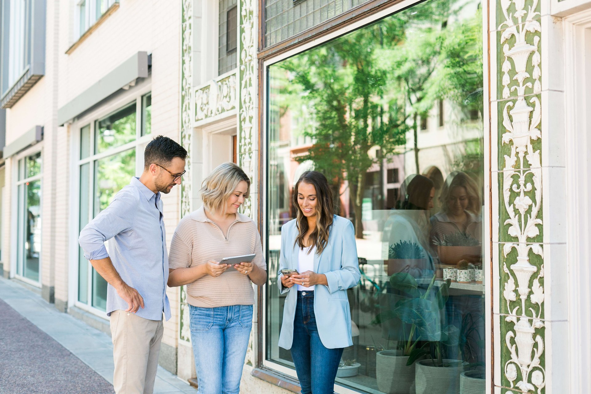 The three real estate professionals from Insiders Realty collaborated using tablet and mobile devices.