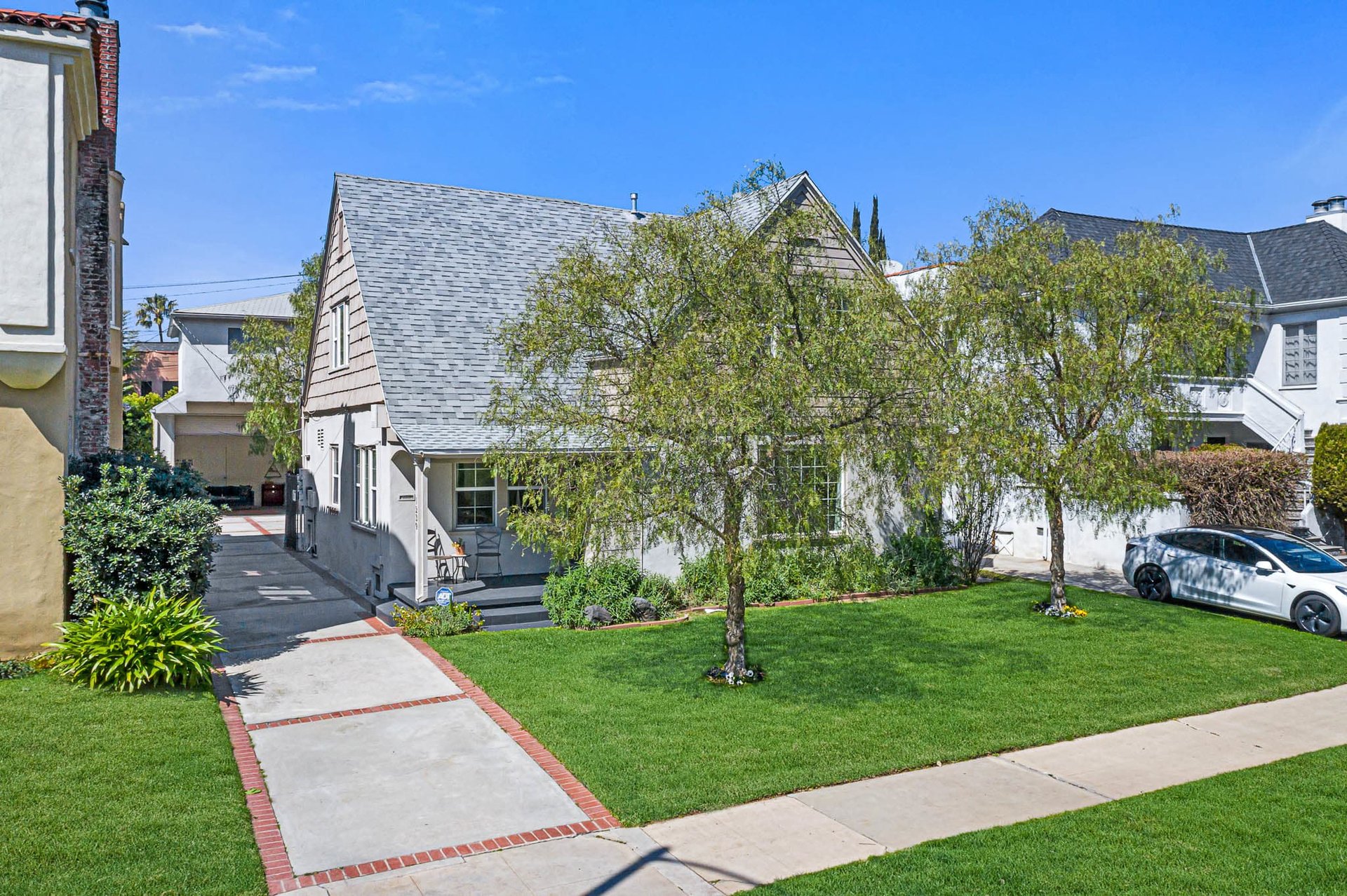 Light & Bright East Coast Traditional Home with Exterior Office & Bonus $2400/mos Rental Unit Above Garage -  in coveted Miracle Mile South!