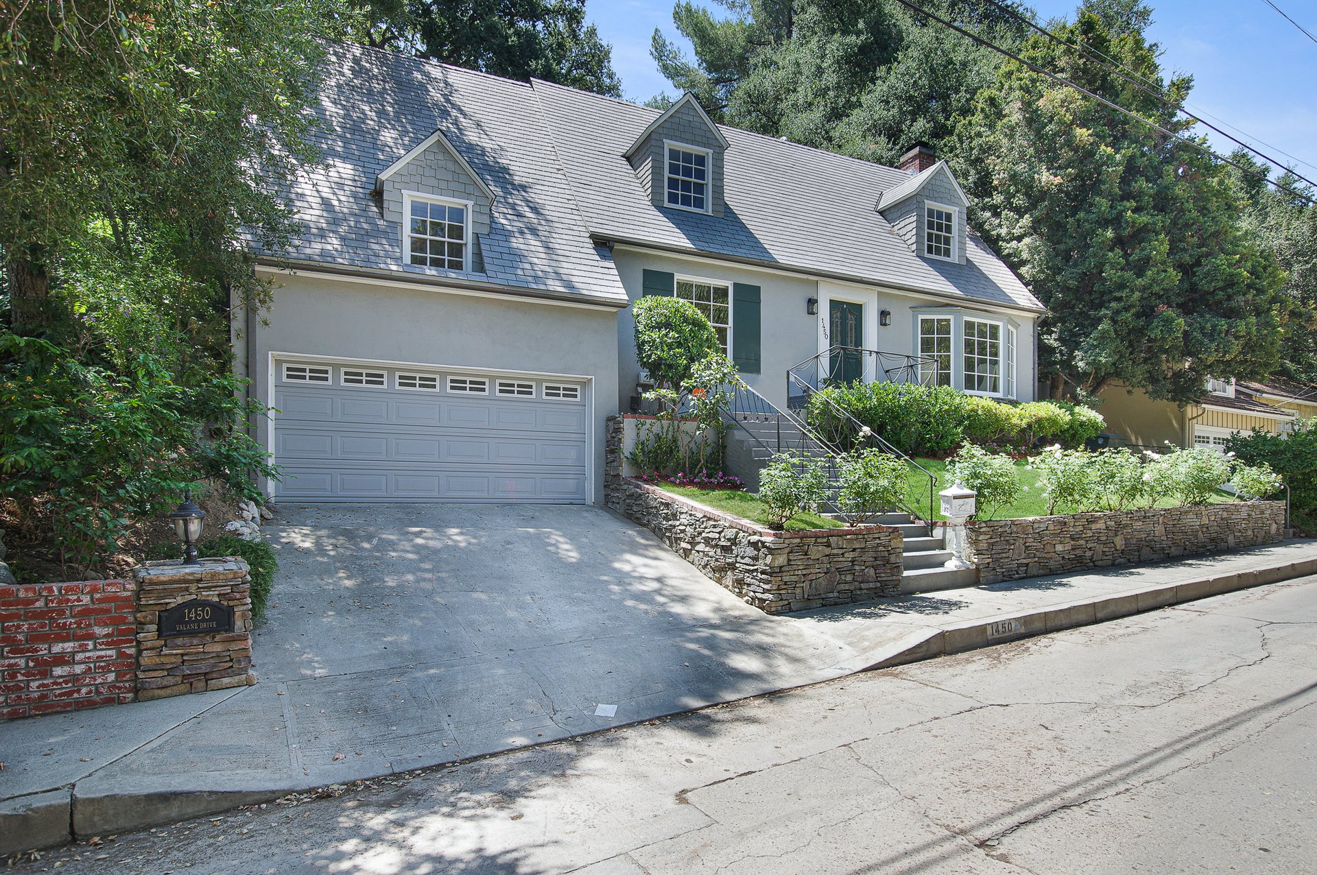 BEAUTIFULLY RESTORED, STORYBOOK CAPE COD HOME IN PRIME VERDUGO WOODLANDS.
