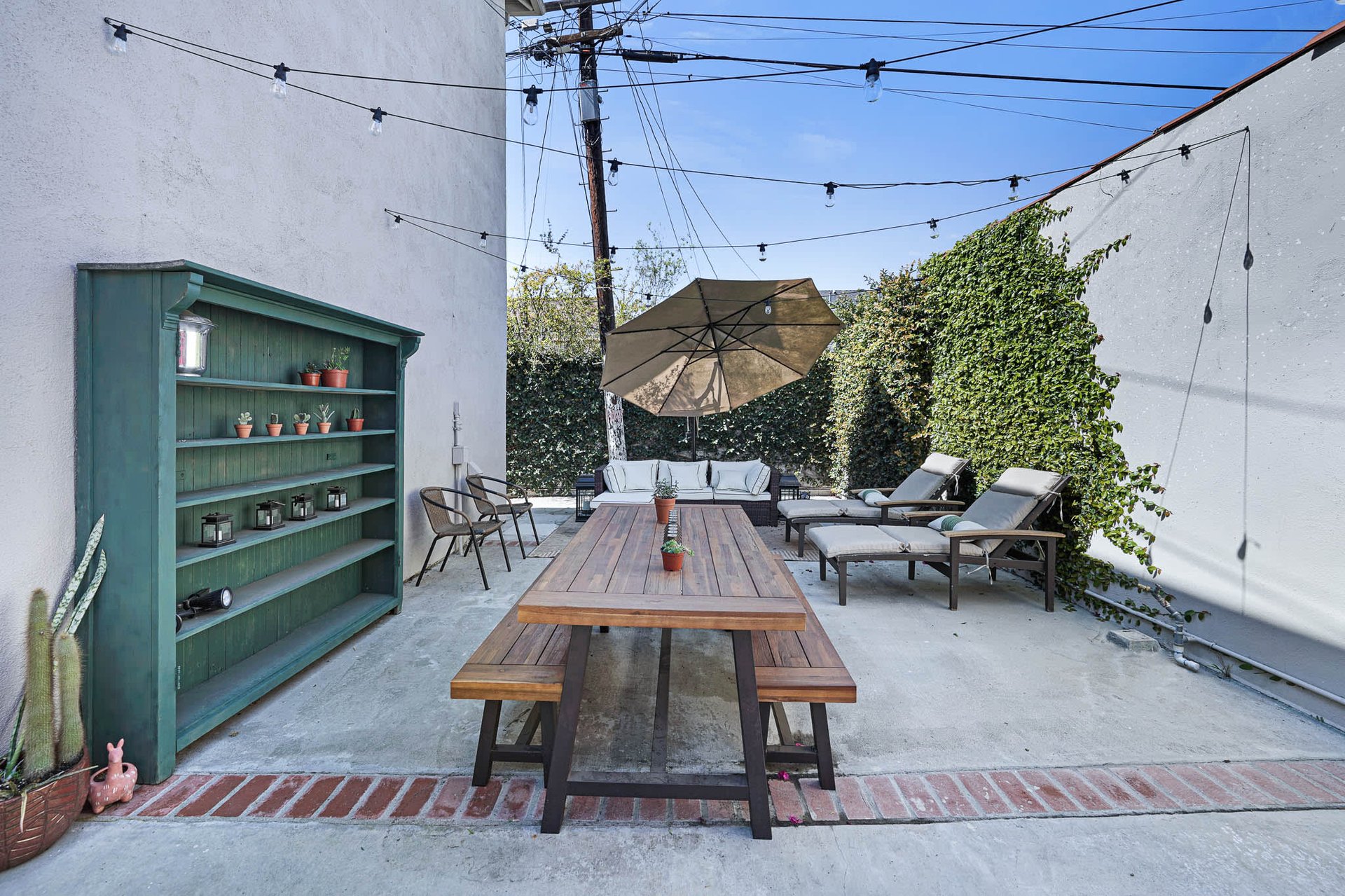 Light & Bright East Coast Traditional Home with Exterior Office & Bonus $2400/mos Rental Unit Above Garage -  in coveted Miracle Mile South!