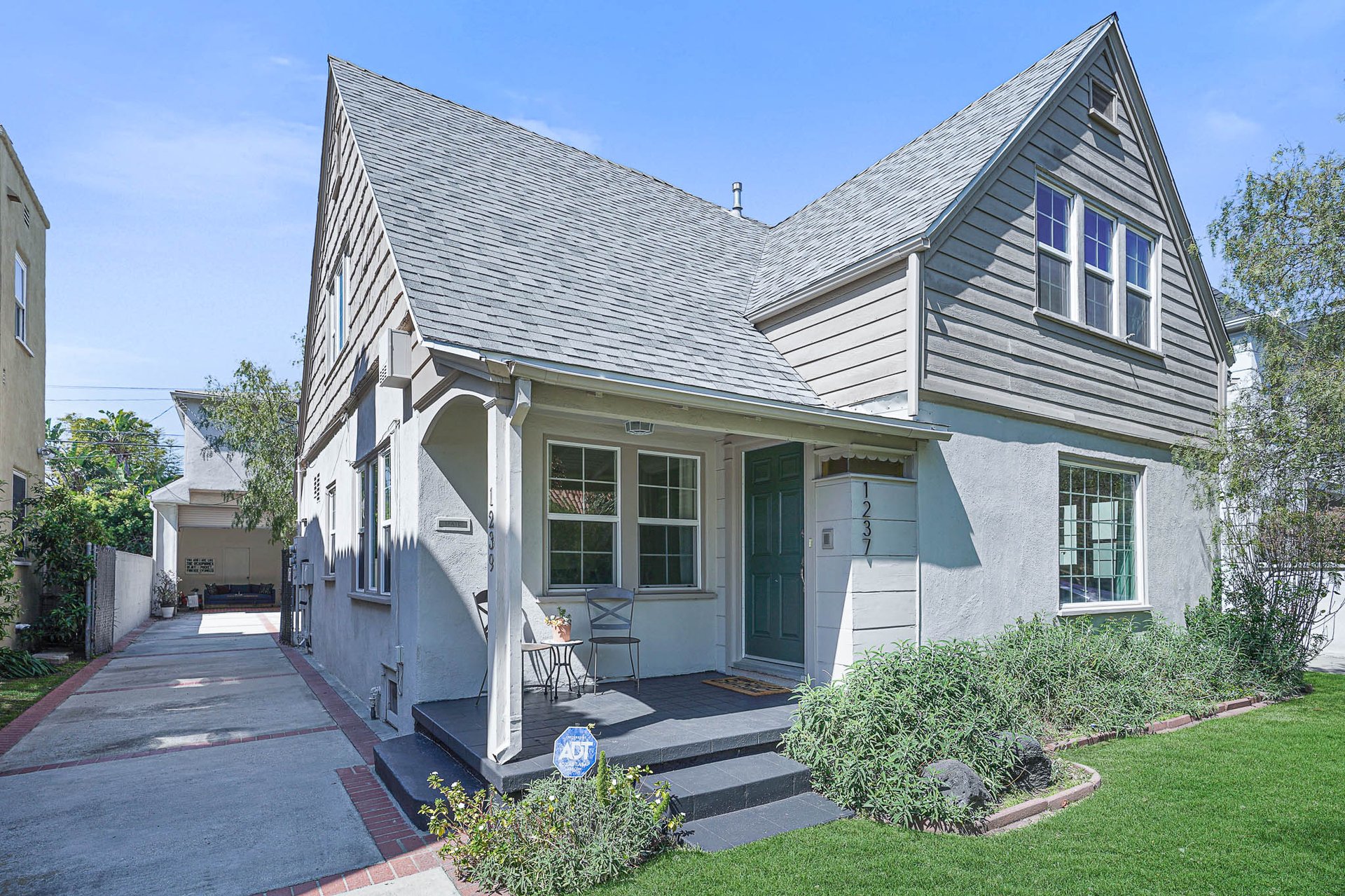 Light & Bright East Coast Traditional Home with Exterior Office & Bonus $2400/mos Rental Unit Above Garage -  in coveted Miracle Mile South!