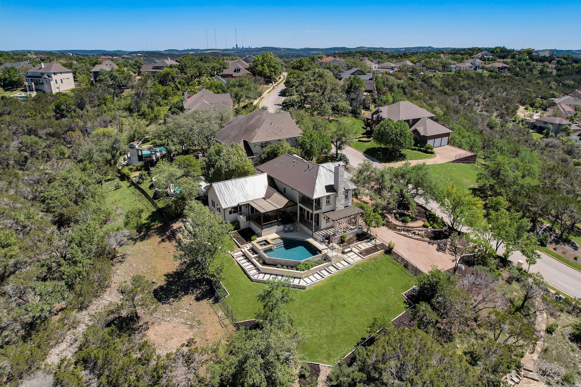 Hill Country Paradise: Luxurious 4/3 Home with Heated Pool/Spa and Spectacular Sunset Views in River Place!