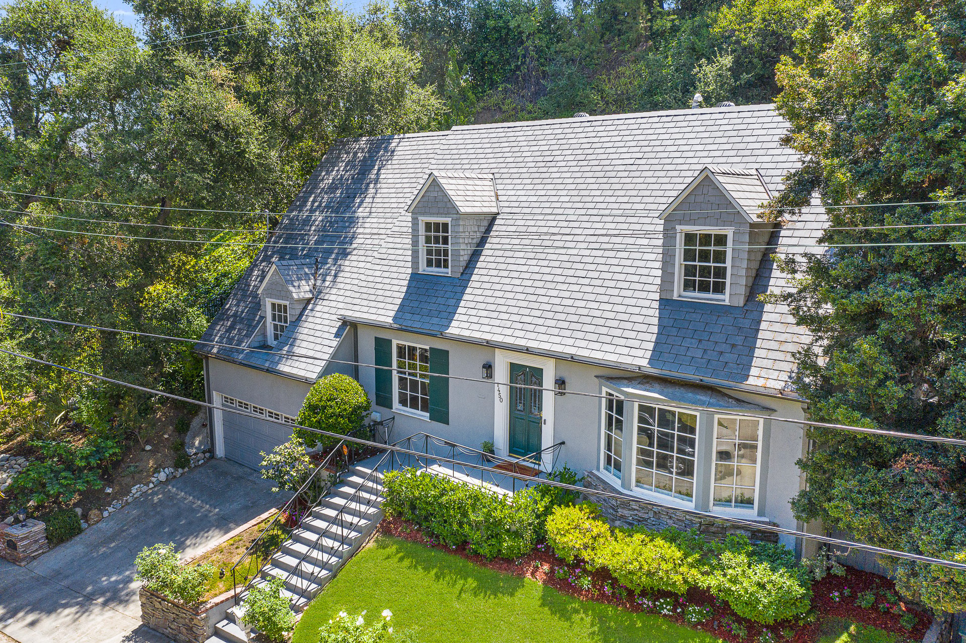 BEAUTIFULLY RESTORED, STORYBOOK CAPE COD HOME IN PRIME VERDUGO WOODLANDS.