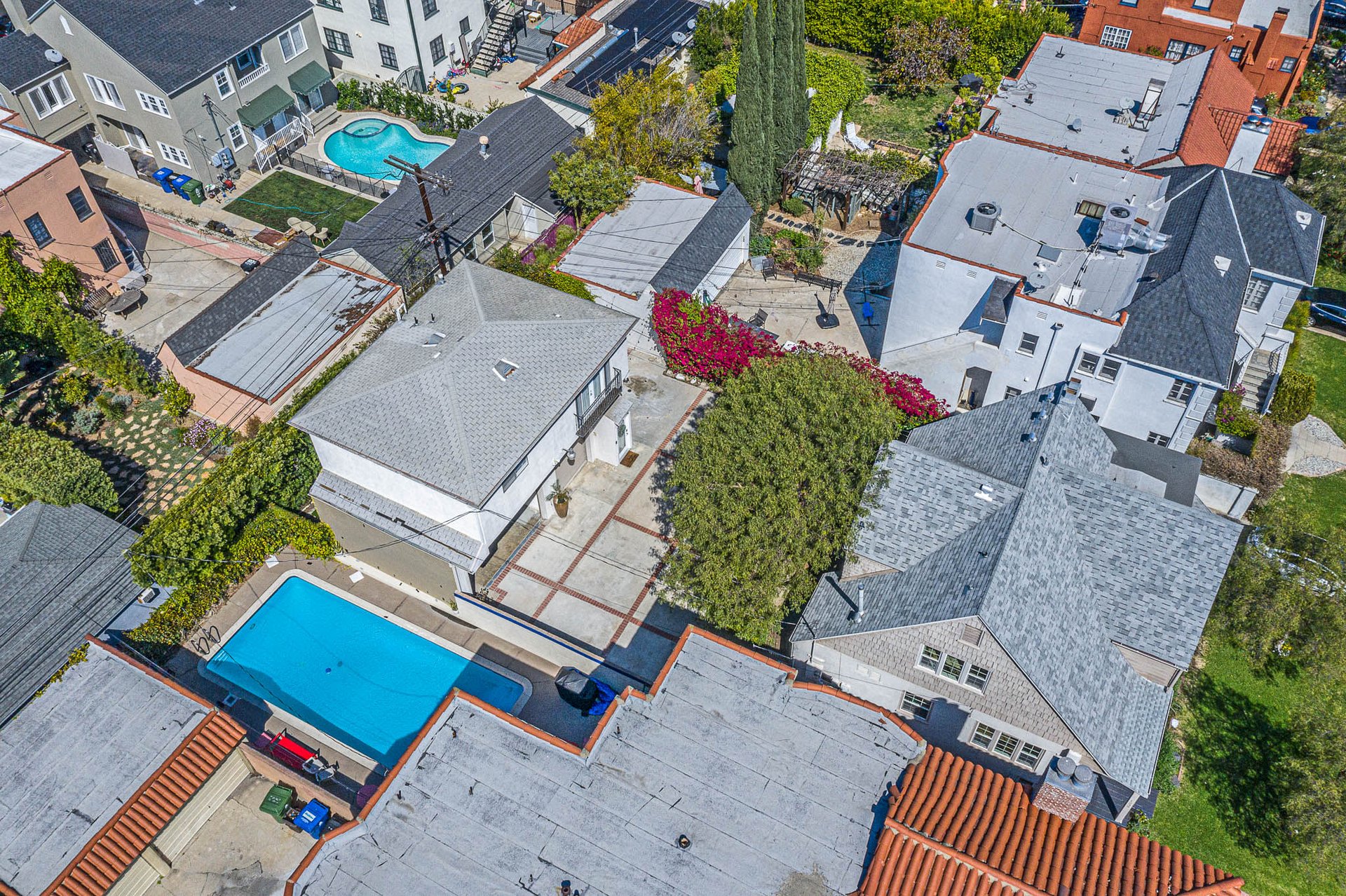 Light & Bright East Coast Traditional Home with Exterior Office & Bonus $2400/mos Rental Unit Above Garage -  in coveted Miracle Mile South!