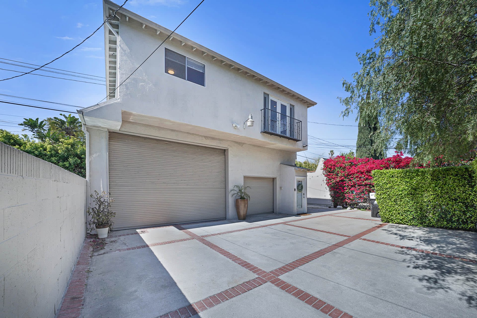 Light & Bright East Coast Traditional Home with Exterior Office & Bonus $2400/mos Rental Unit Above Garage -  in coveted Miracle Mile South!