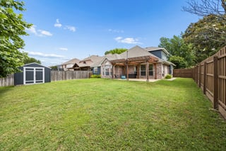 Pergola-covered patio and private backyard at 9217 Inverness in Waterview Rowlett