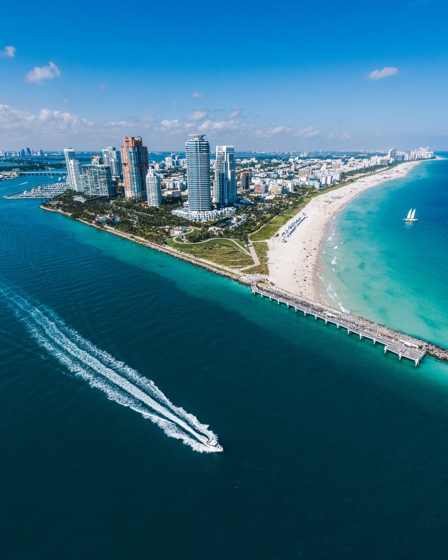Aerial view of a waterfront skyline and coastline