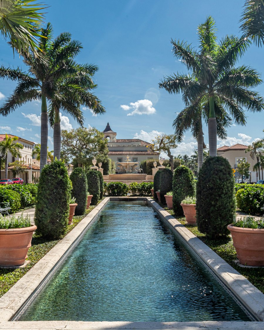 Palm-lined courtyard beside an estate