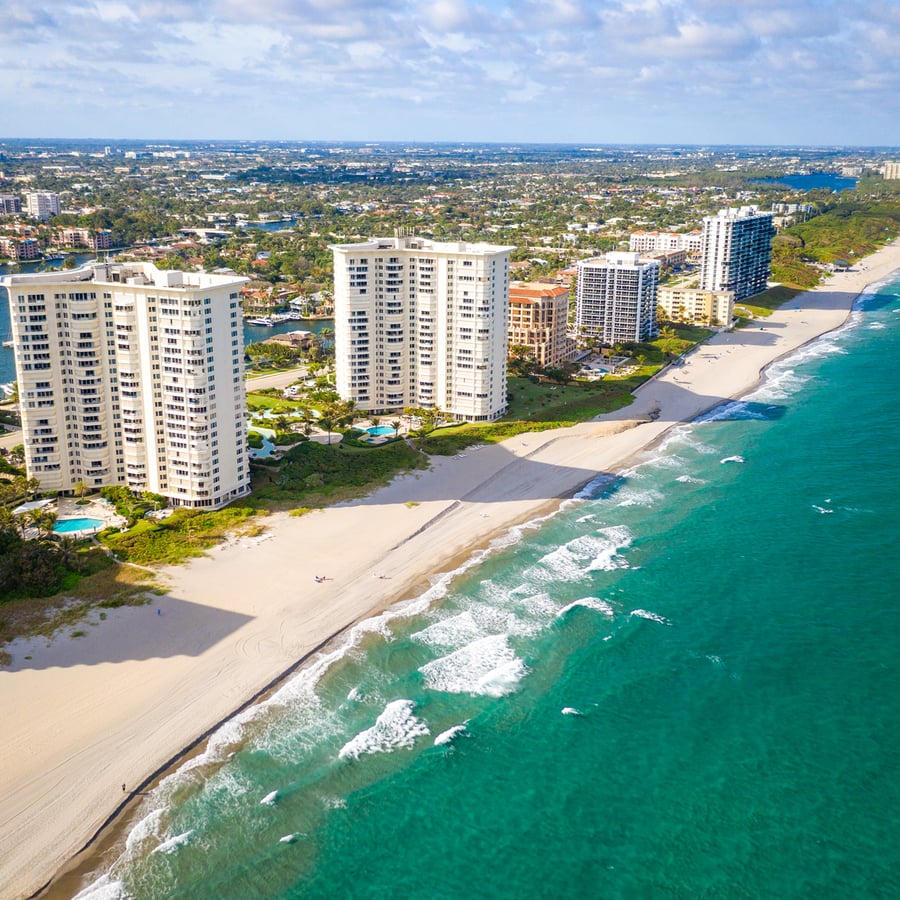 Aerial view of beachfront residences and the coastline