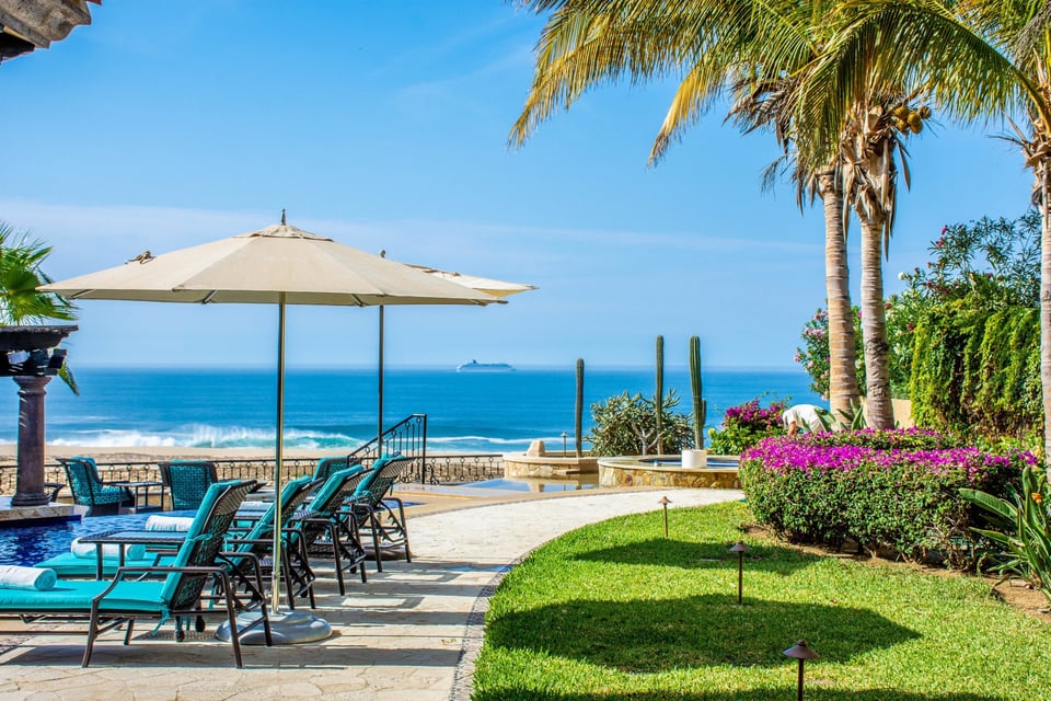 Oceanfront home terrace with pool and beach view in Quivira