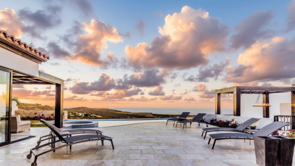 Coronado terrace and infinity pool with Pacific Ocean views at sunset