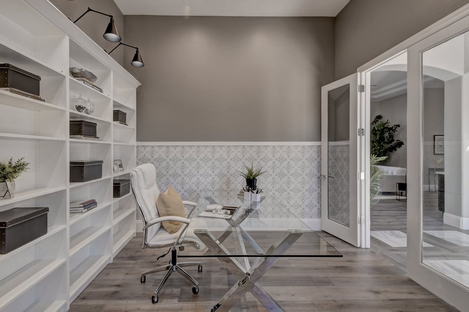 Elegant Scottsdale home office with built-in shelving and French doors