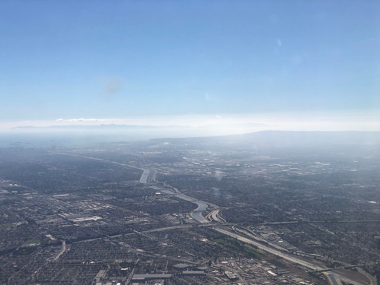 Regional aerial view along the Los Angeles River and Interstate 710 toward Long Beach, October 2021