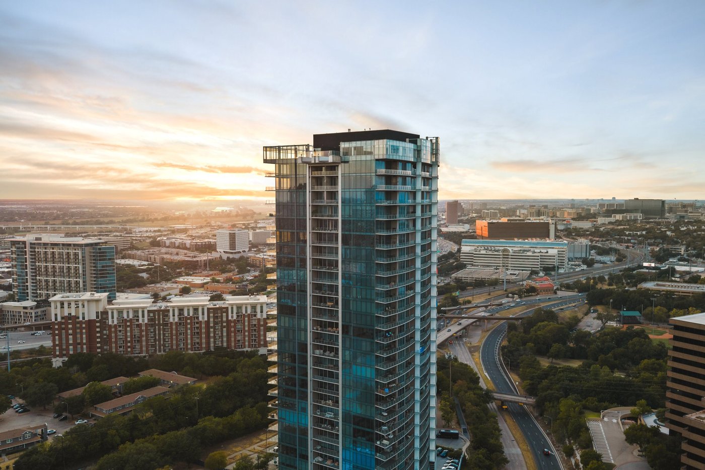 The upper floors of Bleu Ciel at sunset, home to Penthouse 2701, in Dallas