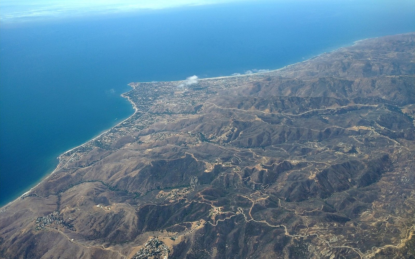 Malibu coast and canyon terrain photographed from the air in July 2021
