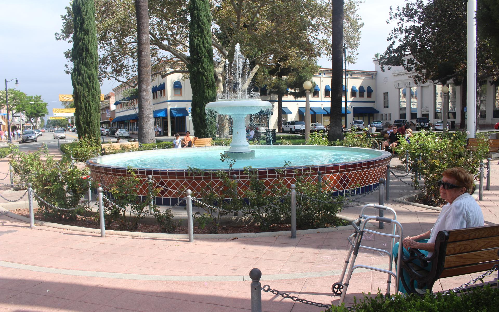 Fountain and storefronts at the Orange Plaza