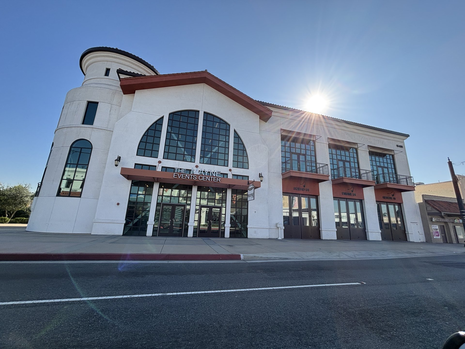 Downtown Bellflower building with arched windows and sidewalk frontage in February 2025