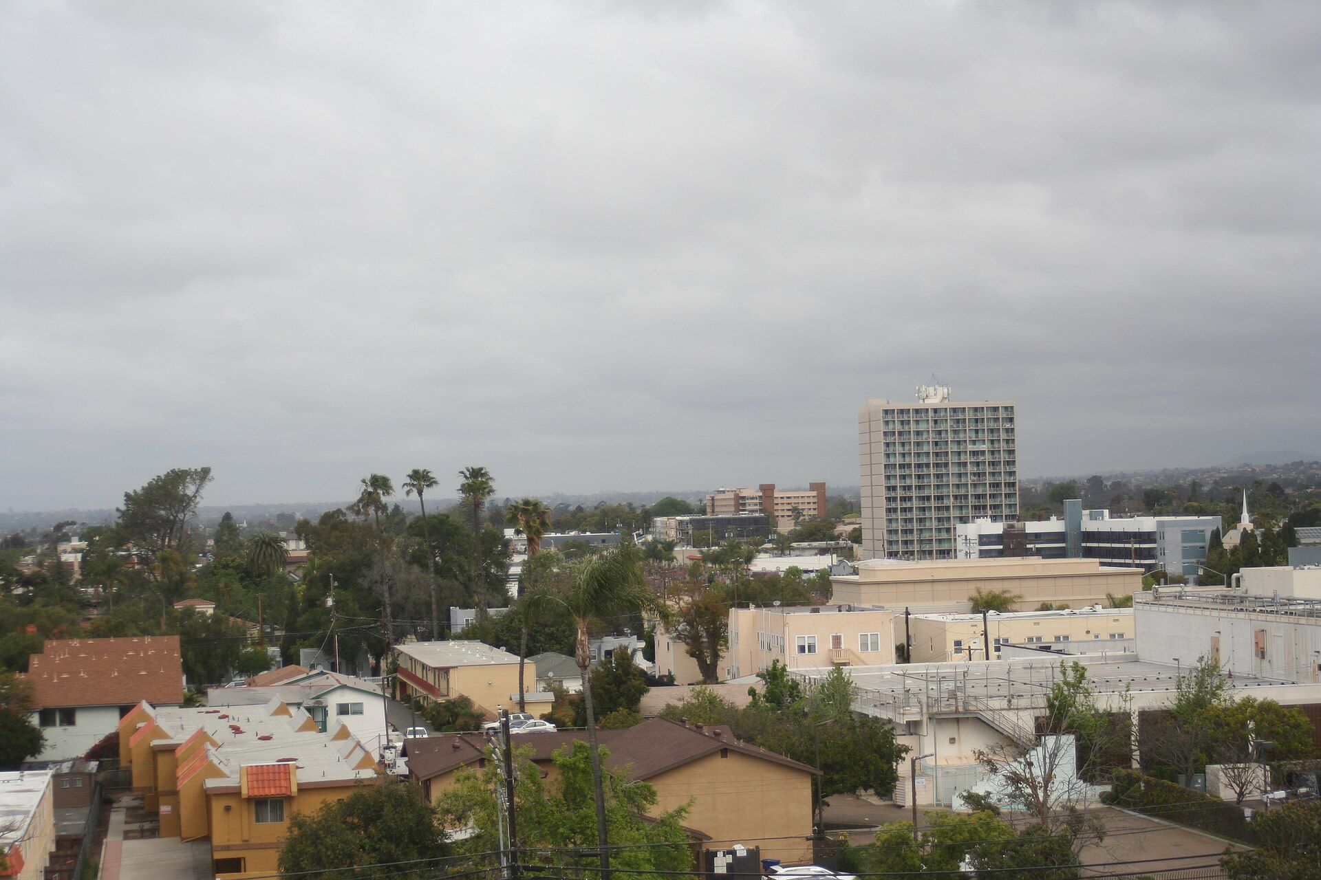 Chula Vista homes and civic buildings beneath a coastal cloud layer