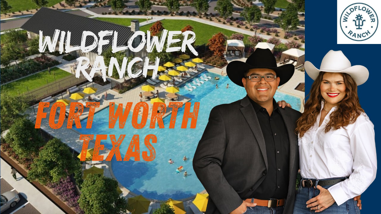 Paige and Edson Miranda, Miranda Realty Team, standing in front of the Wildflower Ranch Fort Worth, TX community sign.