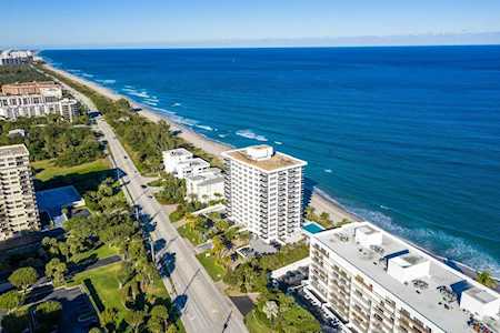 Oceanfront condominiums and a coastal road beside the Atlantic Ocean in East Boca.