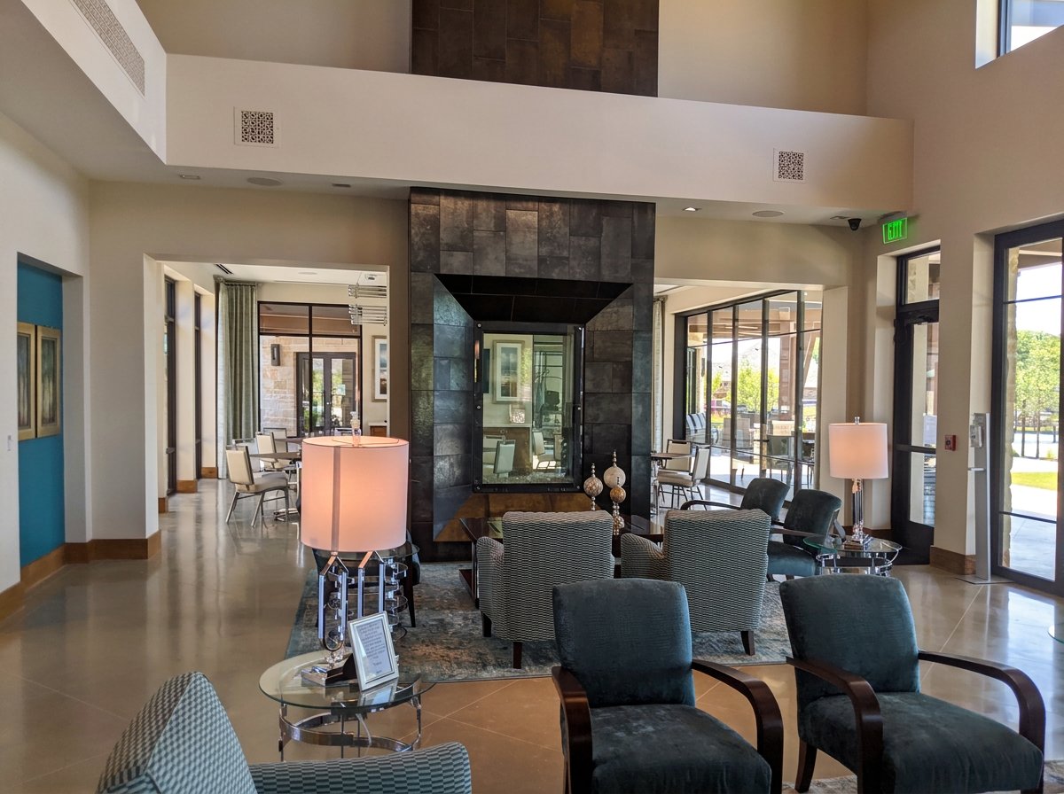 Fireplace and seating area in the  Magnolia Lifestyle Center reserved for the residents of the age restricted Elements at Viridian.