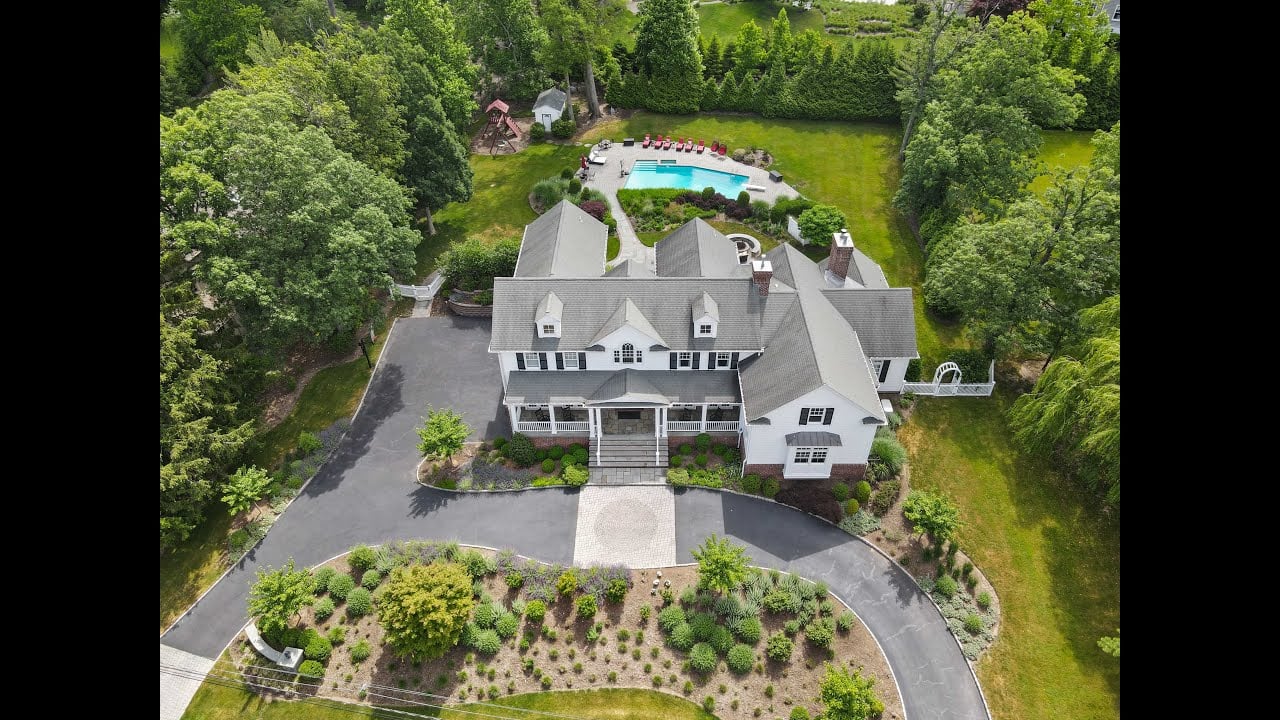 Set back & perched high, a picture perfect Hamptons style beauty on the coveted E. Hill of Tenafly