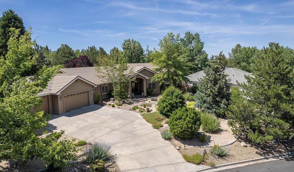 Quiet residential street in Fieldcreek with mature landscaping