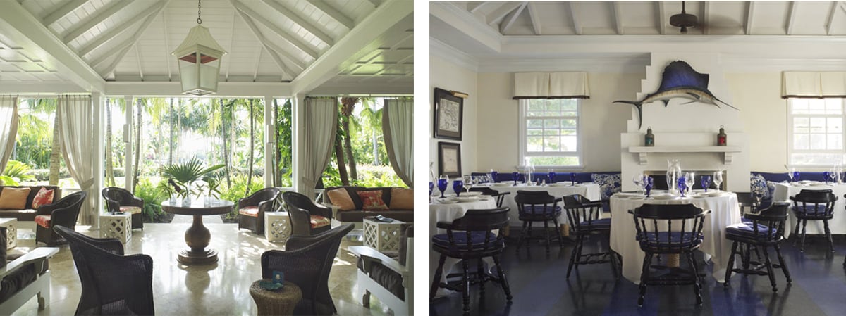 Furnished lounge and dining room, with wicker seating facing a tropical garden and a fish mounted above the fireplace.
