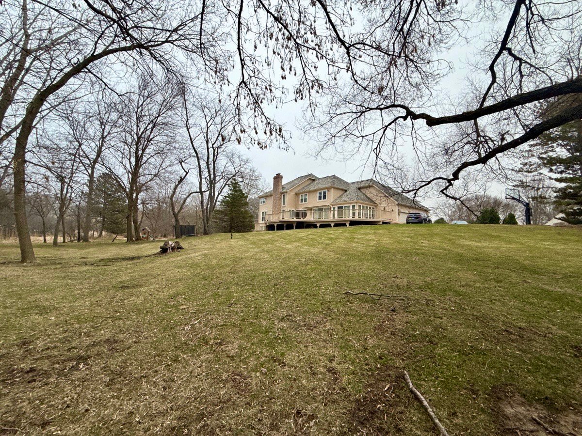 Back Exterior overlooking large backyard and conservation area