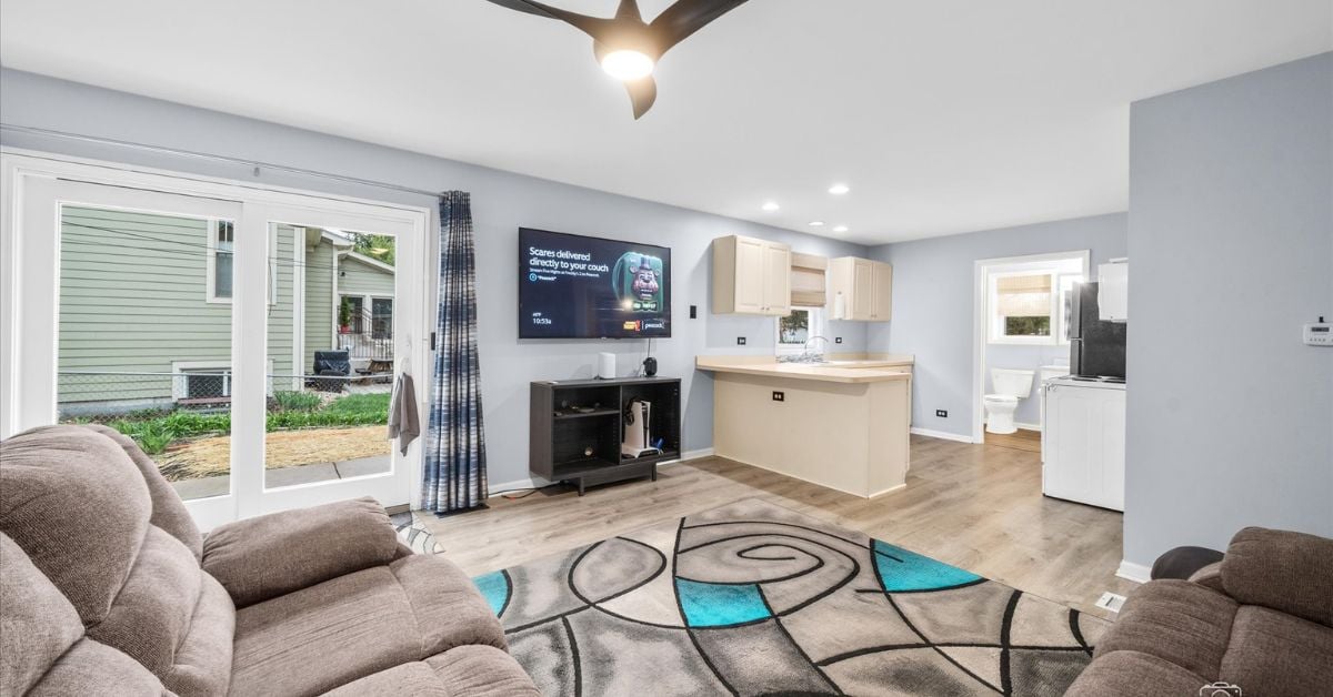 In law suite living area with open floor plan and kitchen at 4217 Elm St Downers Grove IL 60515 listed by the Tully Team