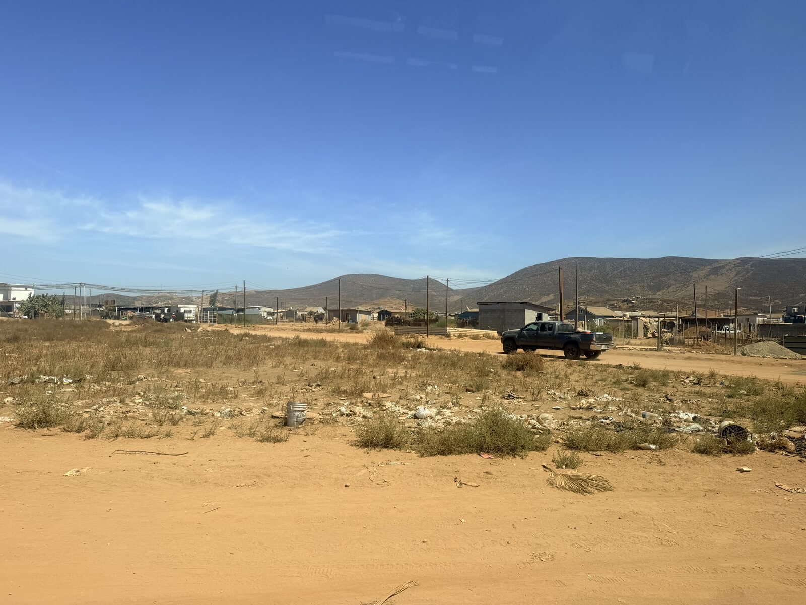 Empty dirt lot in Baja California before the September 2026 Impact MVMT house build