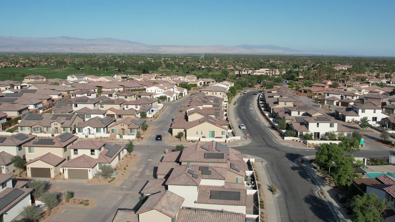 Aerial view of PGA West homes beside a golf fairway in La Quinta, California