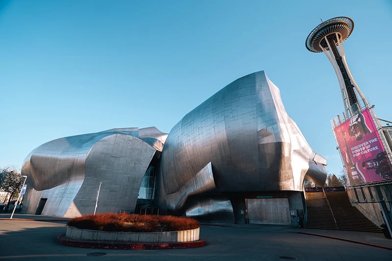 Seattle’s Museum of Pop Culture beside the Space Needle, viewed from the plaza.