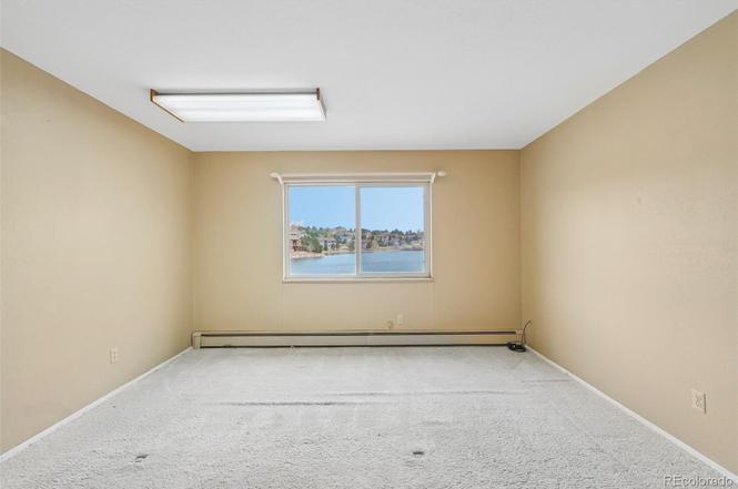 Lake Woodmoor Investor Special – Rare 1-Bed Lakeside Townhome with Huge Upside
