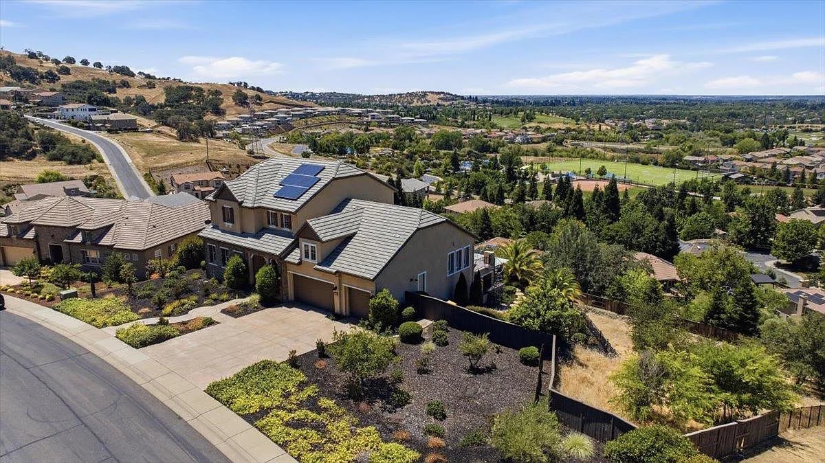 The grand Mediterranean-inspired facade of 1514 Elmores Way, a legacy estate located in the gated Promontory community of El Dorado Hills.