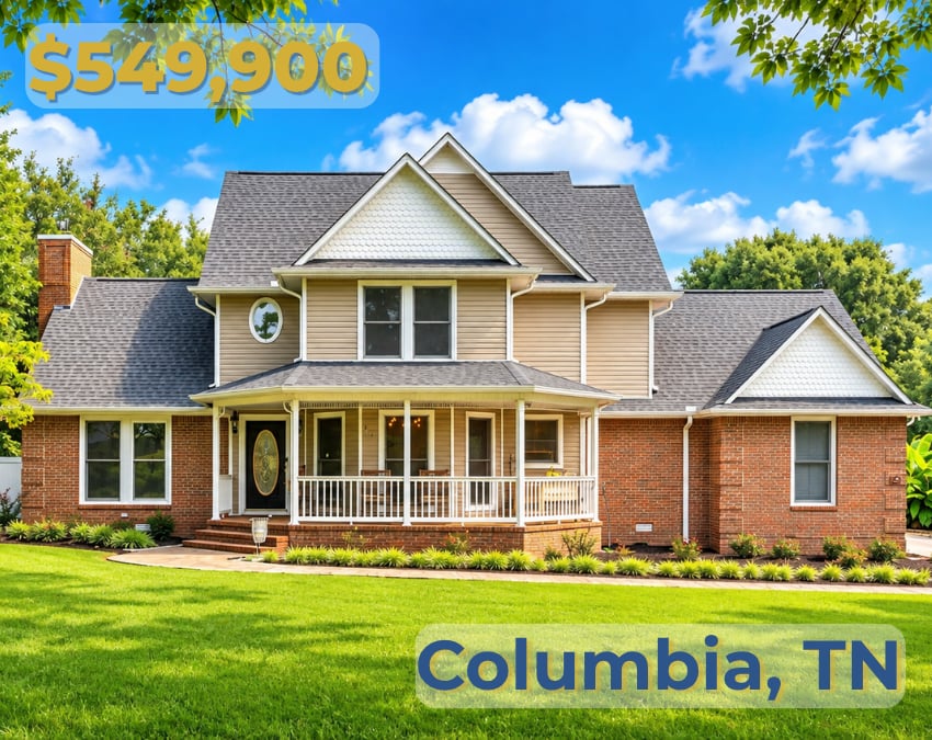 Two-story home with brick wings, tan siding, and a covered front porch.