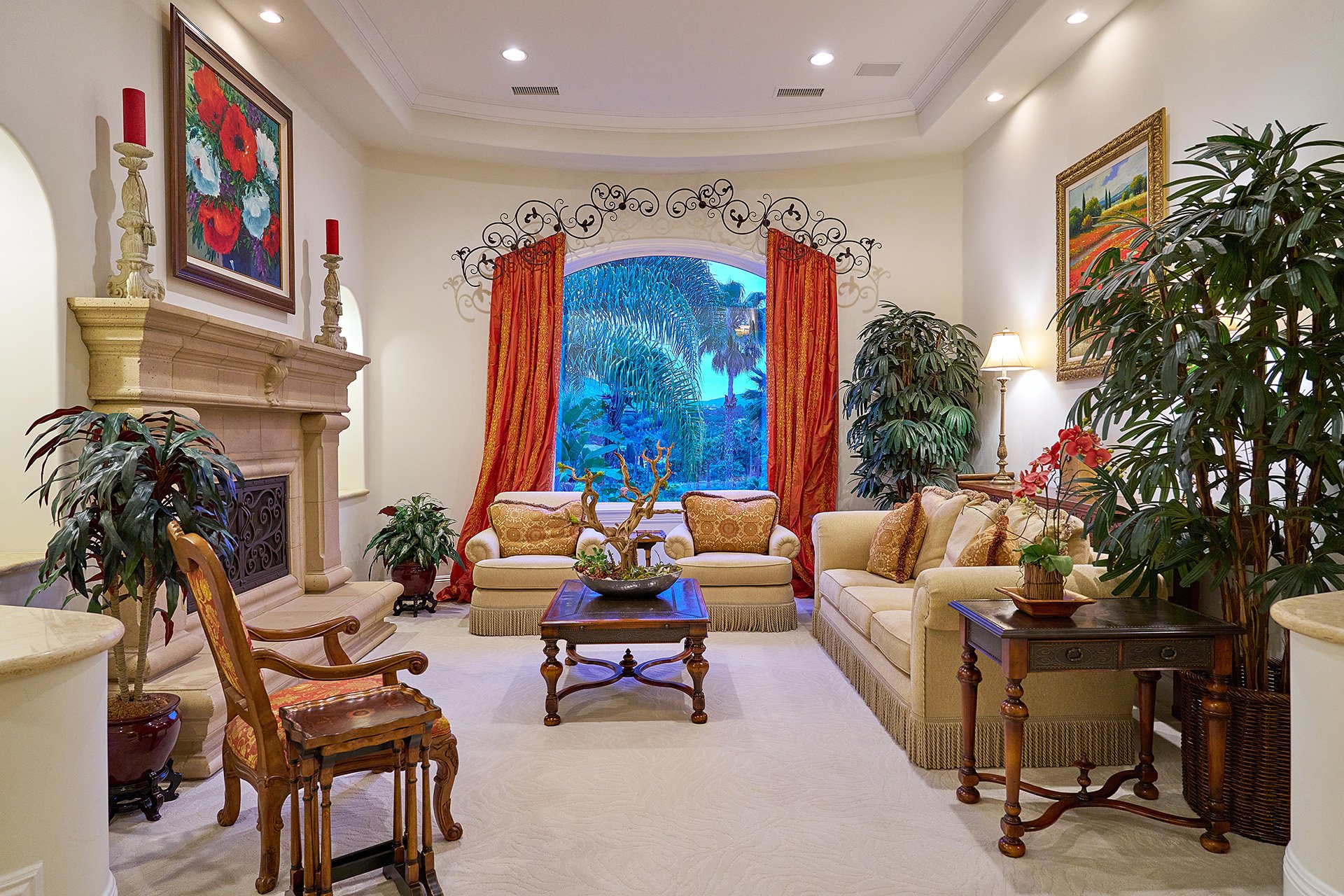Living room with coffered ceiling and picture windows at 6319 Via Naranjal