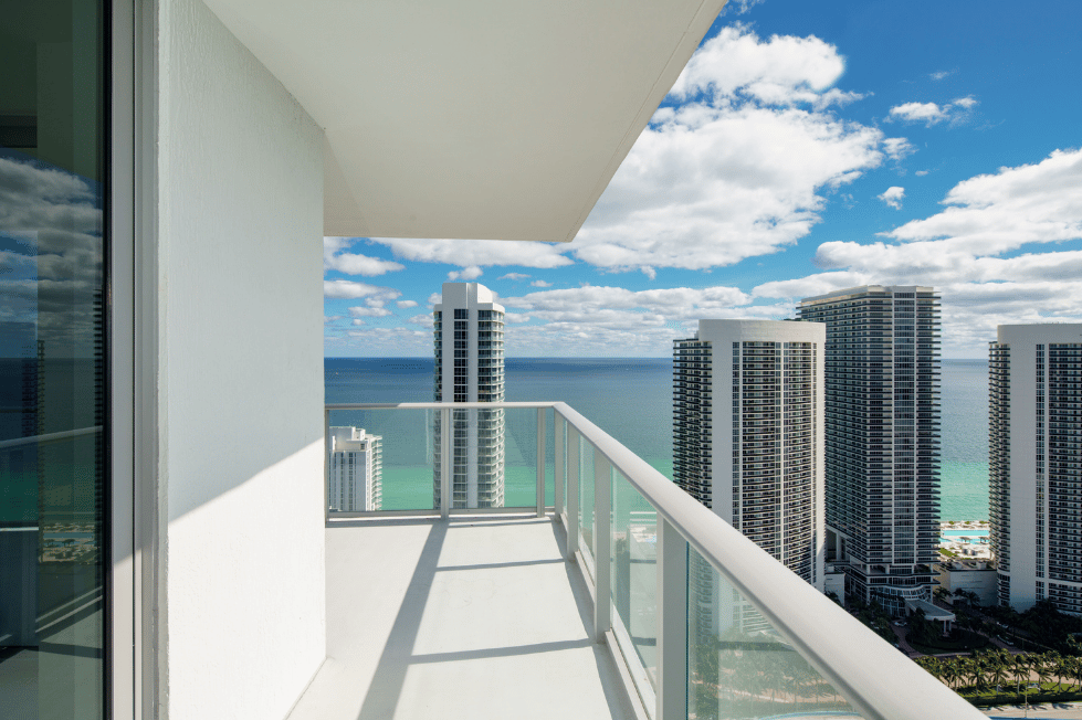 Ocean-view condominium balcony illustrating rental property selection.