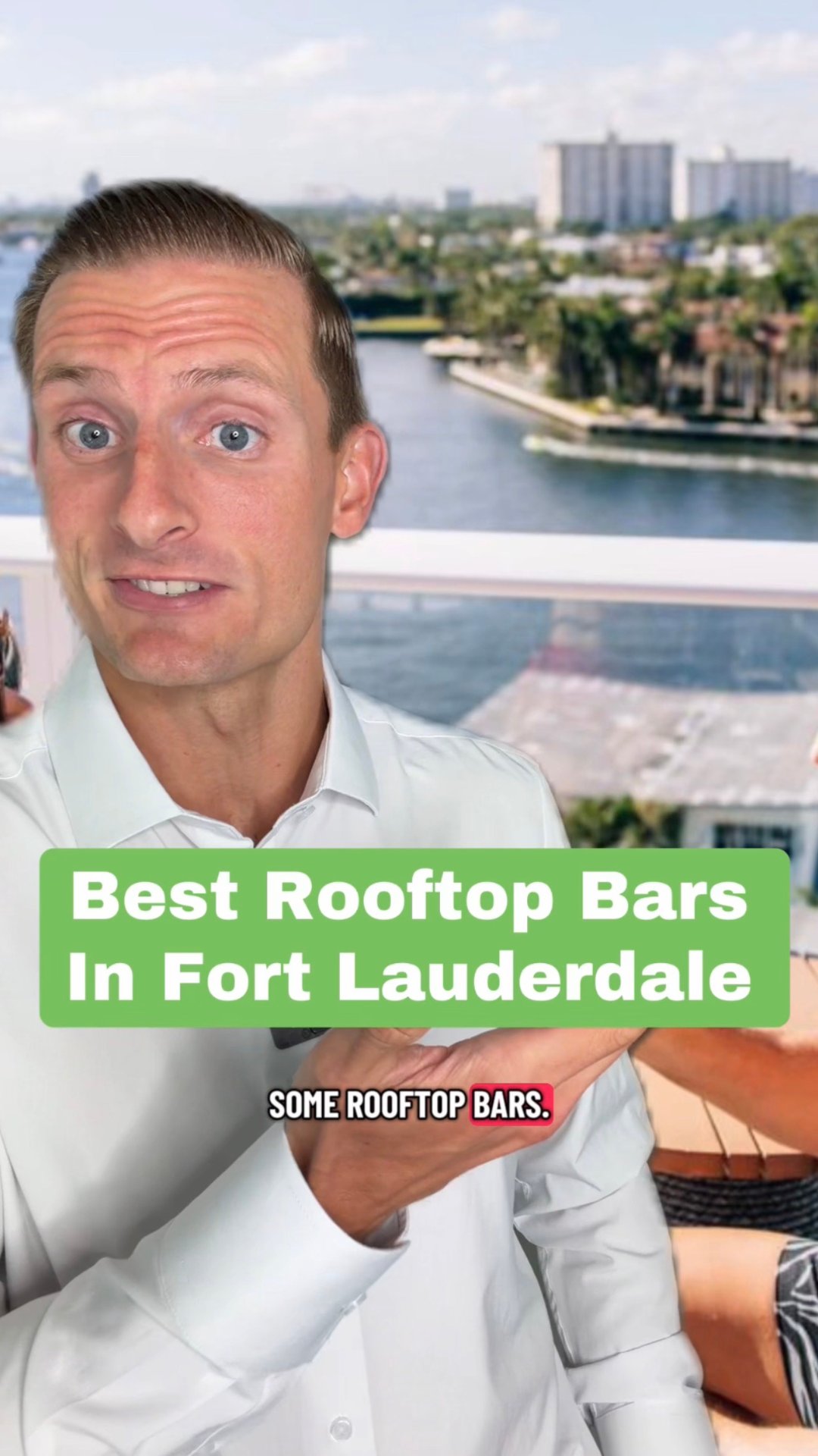 Man in a white shirt presents a Fort Lauderdale rooftop bars feature beside a waterfront view.