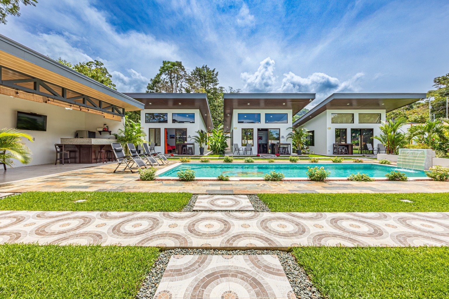 Incredible turnkey investment opportunity, 3 Rental villas, and a 2 Bedroom Home with a large pool.