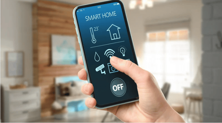 Smart home controls on a phone held in a bright living room.