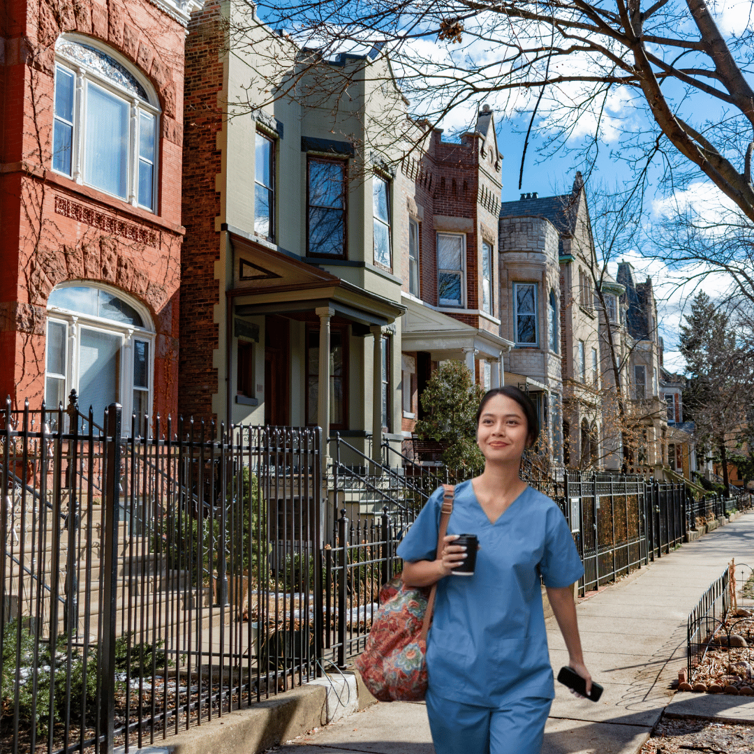 Young medical resident walking through downtown Chicago near condo buildings, symbolizing the transition from student housing to homeownership.