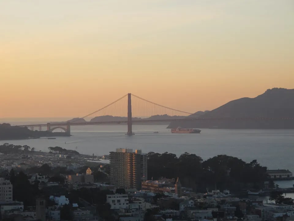 Golden Gate Bridge at sunset viewed from Coit Tower with Marin Headlands and San Francisco Bay
