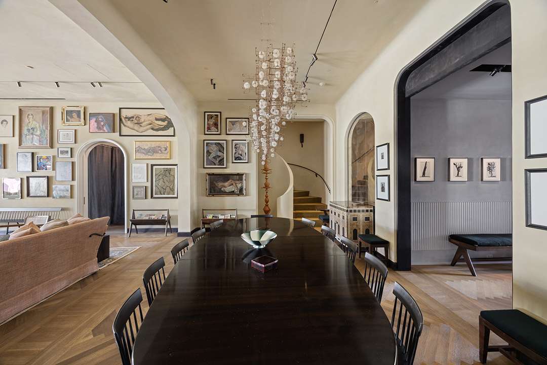 Architectural stairwell with open floating design and natural material palette in the penthouse at 20 Greene Street, redefined by designer Axel Vervoordt and profiled by Brendan Brown Real Estate.