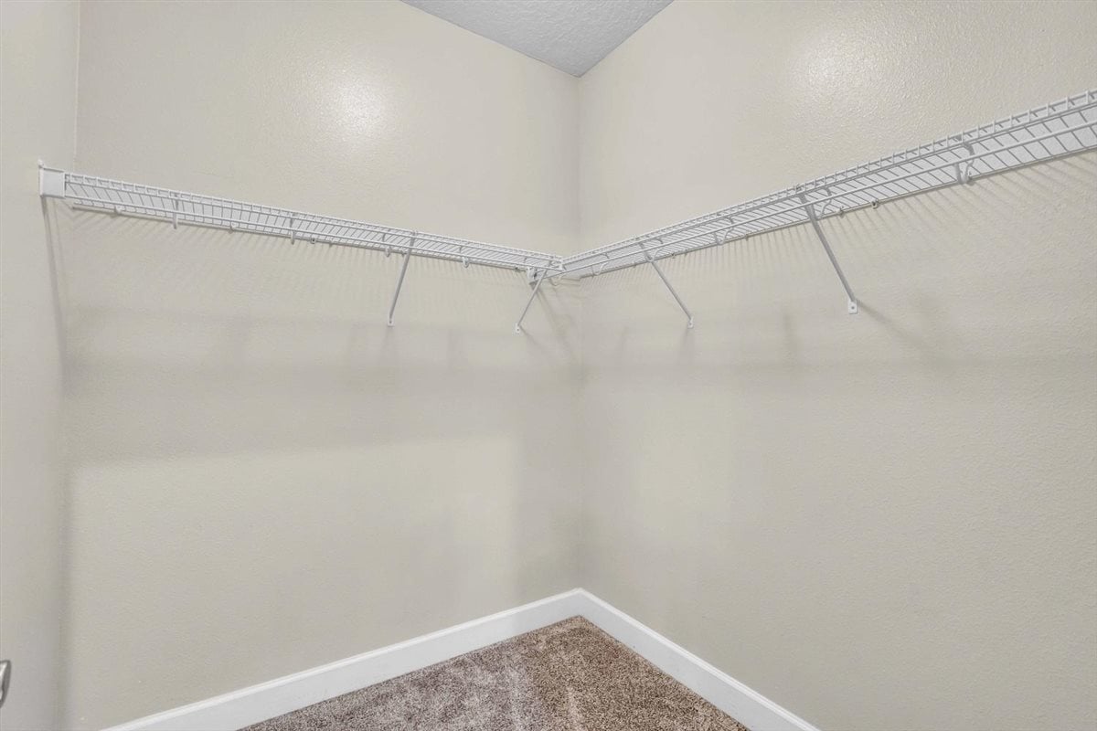 Walk-in closet in the primary