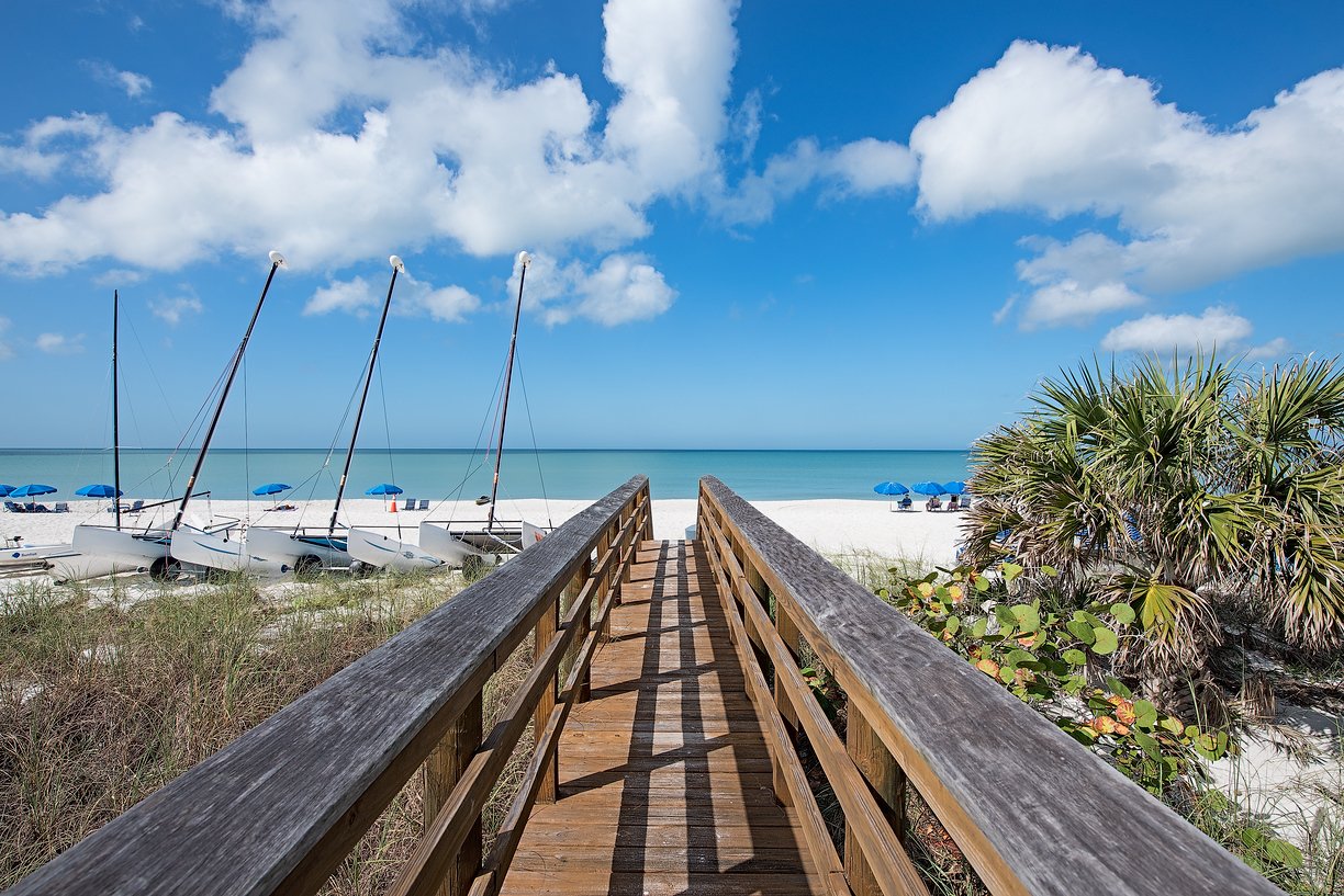 Pelican Bay Condos vs Villas: How to Decide
